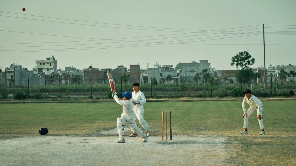 Children play cricket.