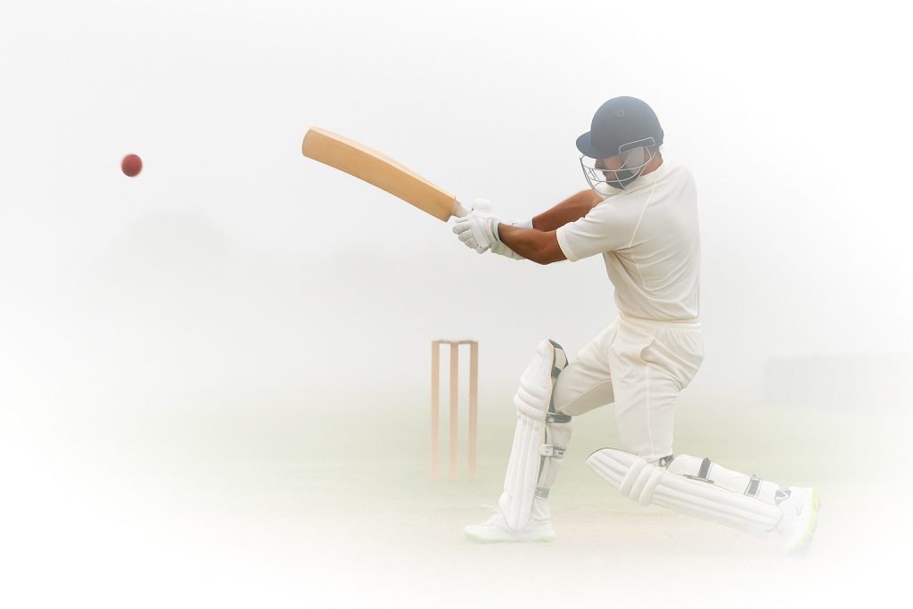 Man plays cricket.