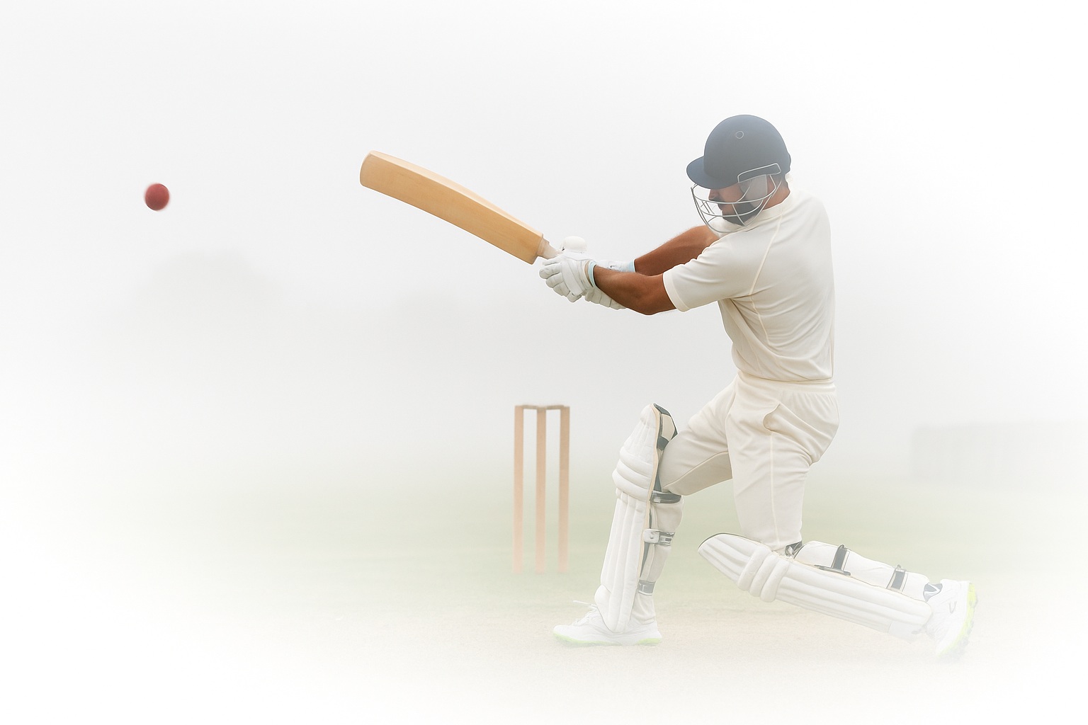 Man plays cricket.
